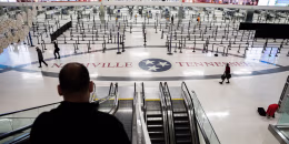 Empty lines inside an airport terminal with NASHVILLE TENNESSEE written on the floor.