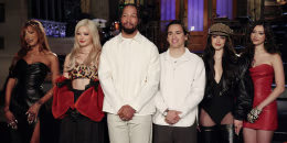 A group portrait of Jalen Brunson and Katseye on stage during an SNL taping.