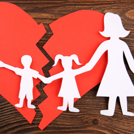 Paper cutout silhouette of a family split apart on a paper heart, divorce concept; Shutterstock ID 339672191; Purchase Order: -