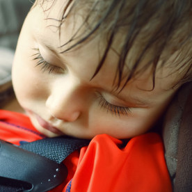 Toddler sleeping in a dangerously hot car
