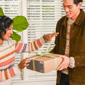 Woman getting a gift from her husband
