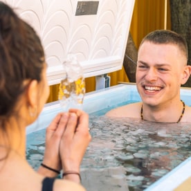 Couple,Bathing,In,The,Cold,Water,Among,Ice,Cubes,With