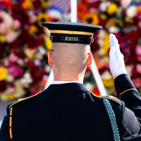 A tomb guard of the 3rd U.S. Infantry Regiment salutes before a centennial ceremony.