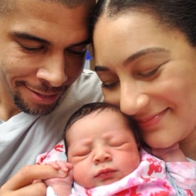 Morgan Radford and David Williams with their daughter.