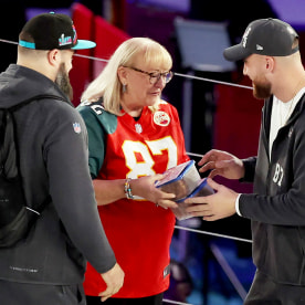 Mother Donna Kelce brings cookies to her son's Jason Kelce and Travis Kelce.