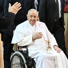 Pope Francis arrives in a wheelchair 