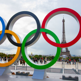 The Olympic Rings being placed in front of the Eiffel Tower