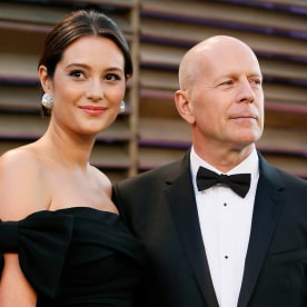 Actor Bruce Willis and his wife Emma Heming arrive at the 2014 Vanity Fair Oscars Party in West Hollywood