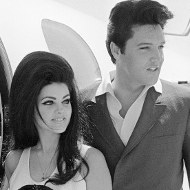 Elvis and Priscilla Presley Posing near Airplane