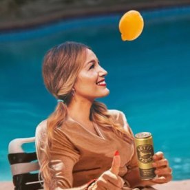 Photoshopped image of Blake Lively sitting poolside with "Betty Booze" drink in hand. 