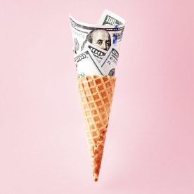 US American dollar bills in ice cream cone. Business, finance, economy, health care diabetes expenditure or consumerism