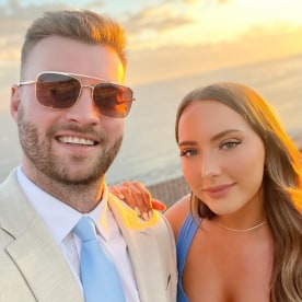 A photo of Mathers and her new husband in front of a sunset.