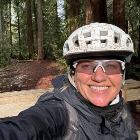 selfie of Kirsten Stein biking.