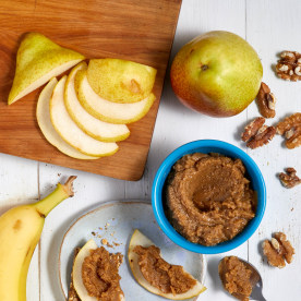 oatmeal cookie walnut butter with apples and bananas shot from above.
