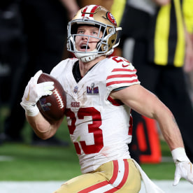 Christian McCaffrey #23 of the San Francisco 49ers runs the ball for a touchdown in the second quarter against the Kansas City Chiefs 