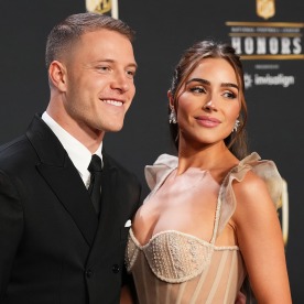 Christian McCaffrey and Olivia Culpo pose for a photo on the red carpet during NFL Honors at the Symphony Hall on February 9, 2023 in Phoenix, Arizona.