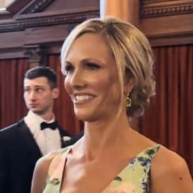 mother of the bride walks down the aisle