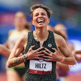Nikki Hiltz celebrates after crossing the finish line on the track