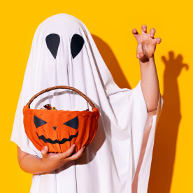 Child in ghost costume