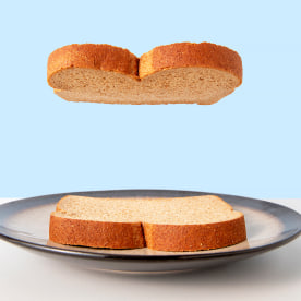 One piece of sliced bread hovering over another slice.