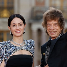 Mick Jagger and his partner US choreographer Melanie Hamrick arrive to attend a state banquet at the Palace of Versailles, west of Paris, on September 20, 2023, on the first day of a British royal state visit to France. Britain's King Charles III and his wife Queen Camilla are on a three-day state visit to France. 