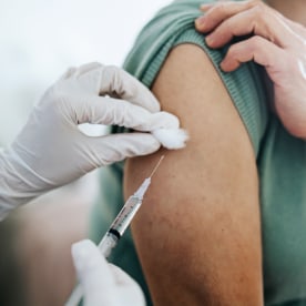 Close up of woman getting flu vaccine.