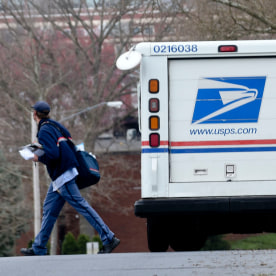 Postal Workers Deliver Mail