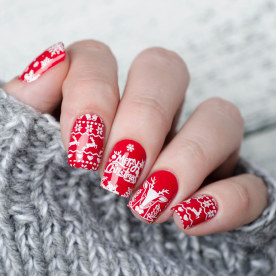 Christmas manicure with deer and snowflakes