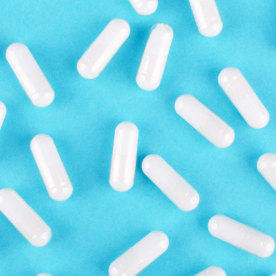 probiotic on blue background, view from above