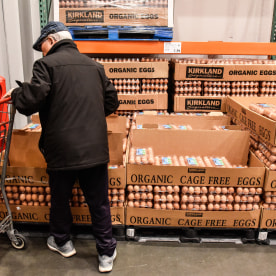 A customer shops for eggs at a Costco store.