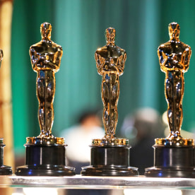 Oscar statuettes are seen backstage.
