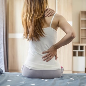 Woman suffering from back ache