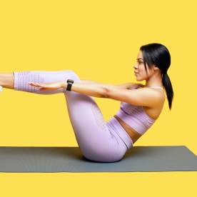 Woman doing abs exercises, yellow background.