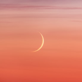 New moon crescent and pastel colors sunset beautiful sky background