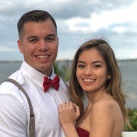 man posting next to a woman