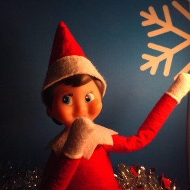 An elf spies something naughty at the Cheers from the Shelf popup bar in Washington D.C.