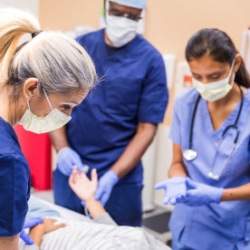 Doctors talking to the patient