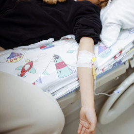 Child with serum connection on her arm