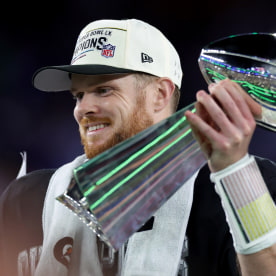 Seattle Seahawks quarterback Sam Darnold celebrates with the Vince Lombardi Trophy after winning Super Bowl LX against the New England Patriots.