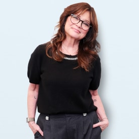 Valerie Bertinelli on a light blue background