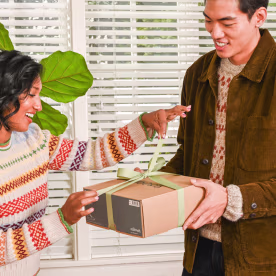 Woman getting a gift from her husband