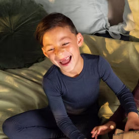 two little boys laughing and enjoying gifts for 8 year olds