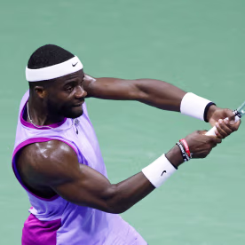 Frances Tiafoe hits a return.