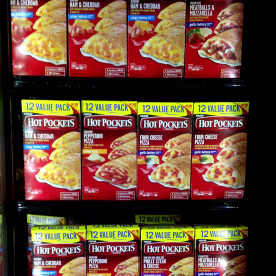Hot Pocket packages stacked in a freezer.