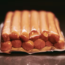 Packaged Sausages in Vacuum-Sealed Plastic for Freshness and Longevity