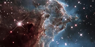 Image::Image: A churning region of star birth in NGC 2174, also known as the Monkey Head Nebula, about 6400 light-years away in the constellation of Orion (The Hunter) is pictured in this handout infrared image mosaic from the NASA/ESA Hubble Space Telescope|NASA via Reuters