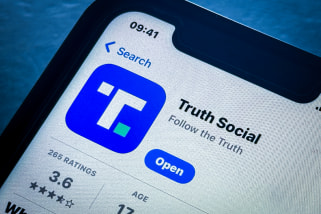Donald Trump's Truth Social app logo on a smartphone.