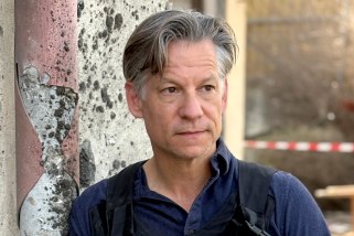 Correspondent Richard Engel in a press flack jacket and helmet.