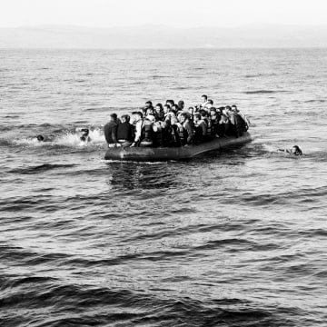 Photographer Giles Duley believes there is a chance to make a difference with even one picture. The London native was working in Sangsar, Afghanistan when he stepped on a landmine. He has endured more than 30 operations in the five years since.


Above: An overcrowded boat of refugees heads to the shore. Two men had fallen from the boat; they were rescued by volunteer Spanish Lifeguards in Lesvos on Oct. 28.