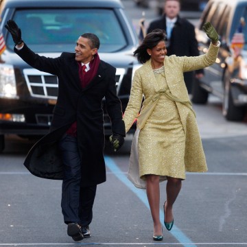 Image: Barack and Michelle Obama walk down Pennsylvania Avenue in Washington